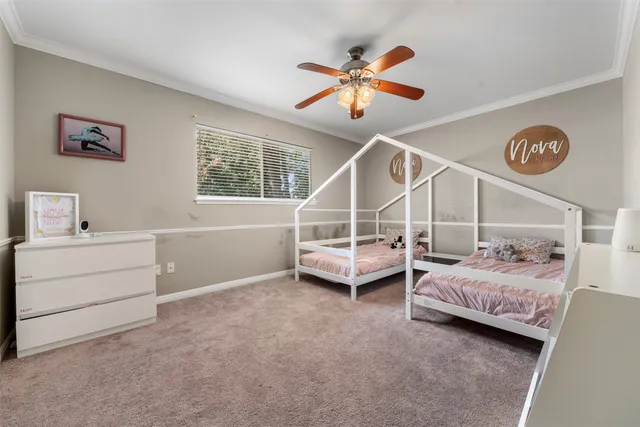 a bedroom with bed and a window