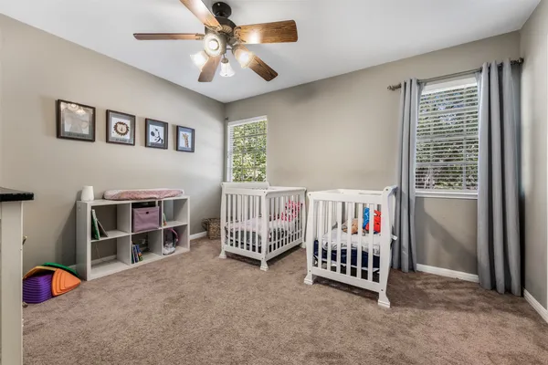 a bedroom with furniture and window