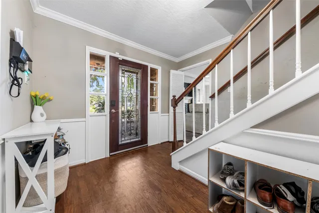 a view of an entryway with wooden floor