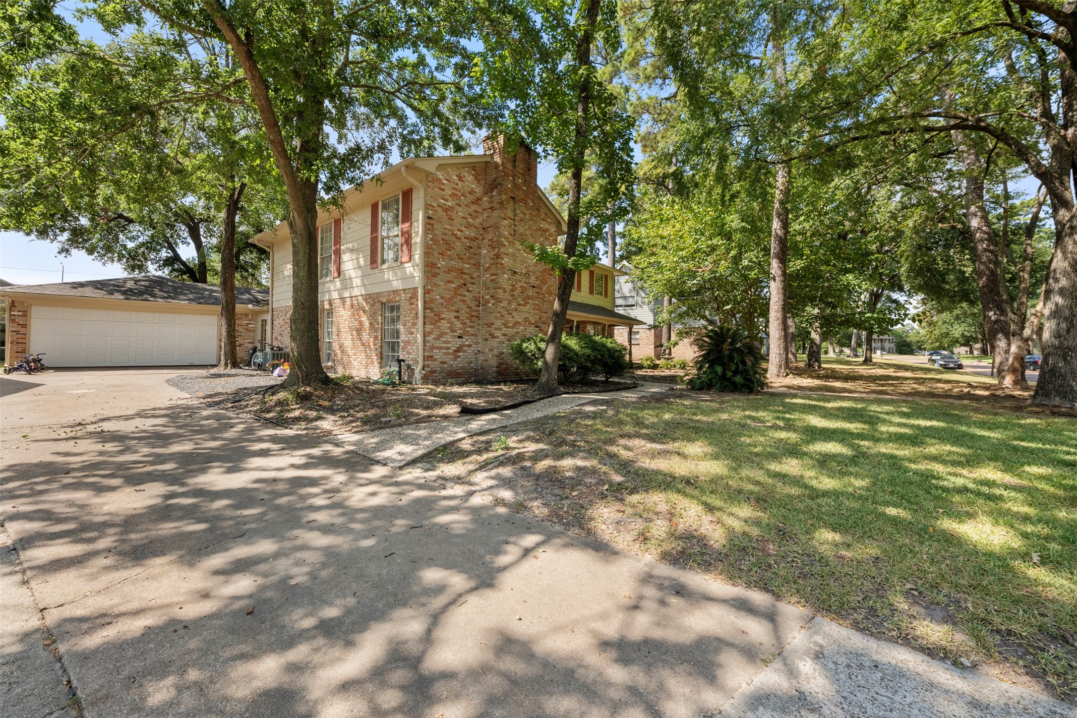 4223 Annawood Circle Spring, TX 77388 - Photo 23 of 30 a backyard of a house with large trees and outdoor shower