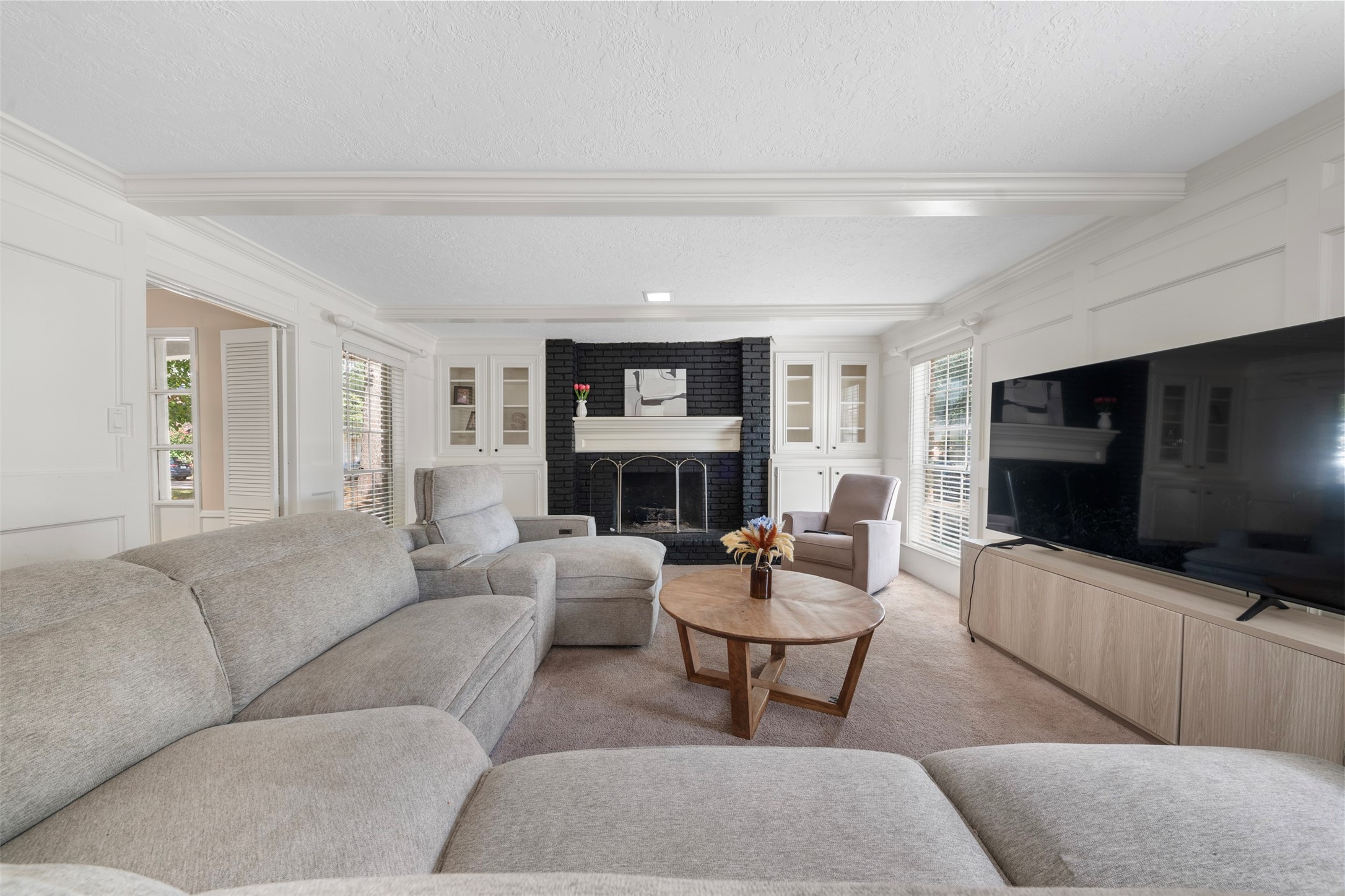 4223 Annawood Circle Spring, TX 77388 - Photo 3 of 30 a living room with fireplace furniture and a flat screen tv