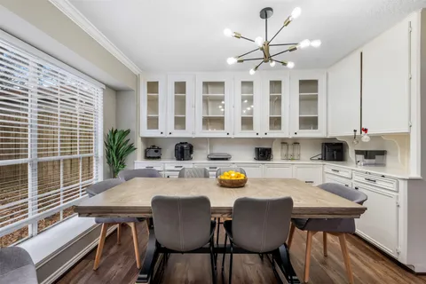 a view of a dining room with furniture and window
