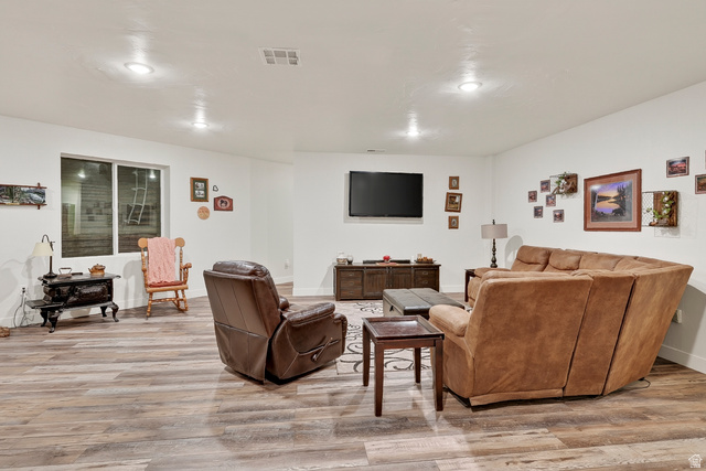 3311 West Allard Summit, UT 84772 - Photo 55 of 97 Spacious entertainment area featuring wood-finish flooring, recessed lighting, and a window