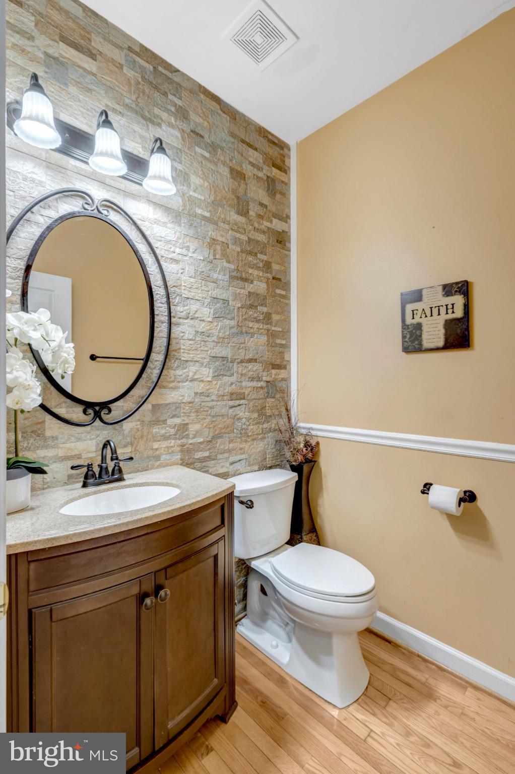 4169 Agency Loop Triangle, VA 22172 - Photo 19 of 56 Charming half bath with stone accents.
