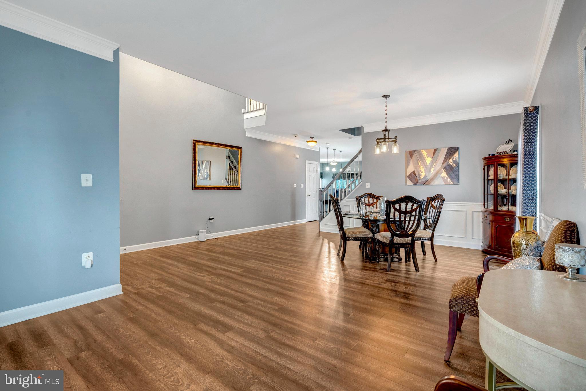 4169 Agency Loop Triangle, VA 22172 - Photo 2 of 56 a view of a dining room with furniture and wooden floor