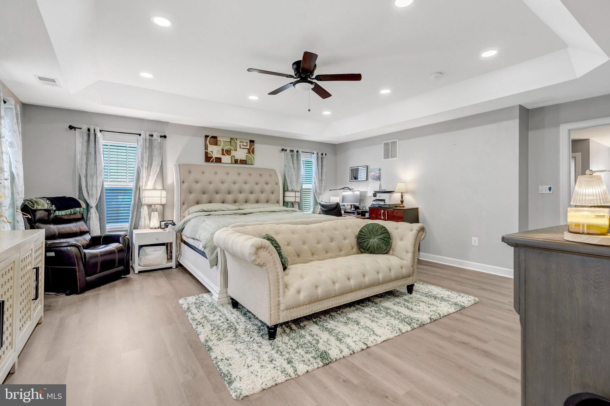 4169 Agency Loop Triangle, VA 22172 - Photo 24 of 56 a bedroom with a large bed and a couch