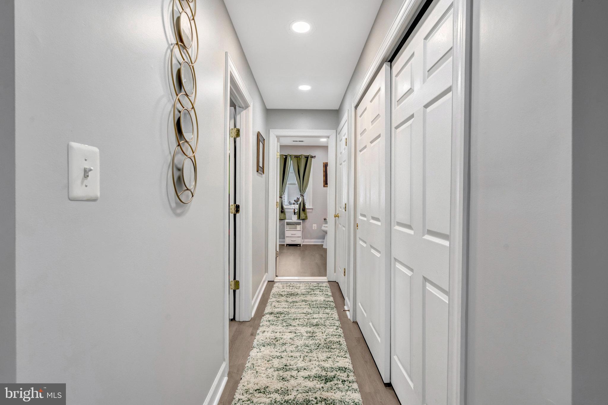 4169 Agency Loop Triangle, VA 22172 - Photo 25 of 56 Inviting hallway to Primary bath modern elegance.