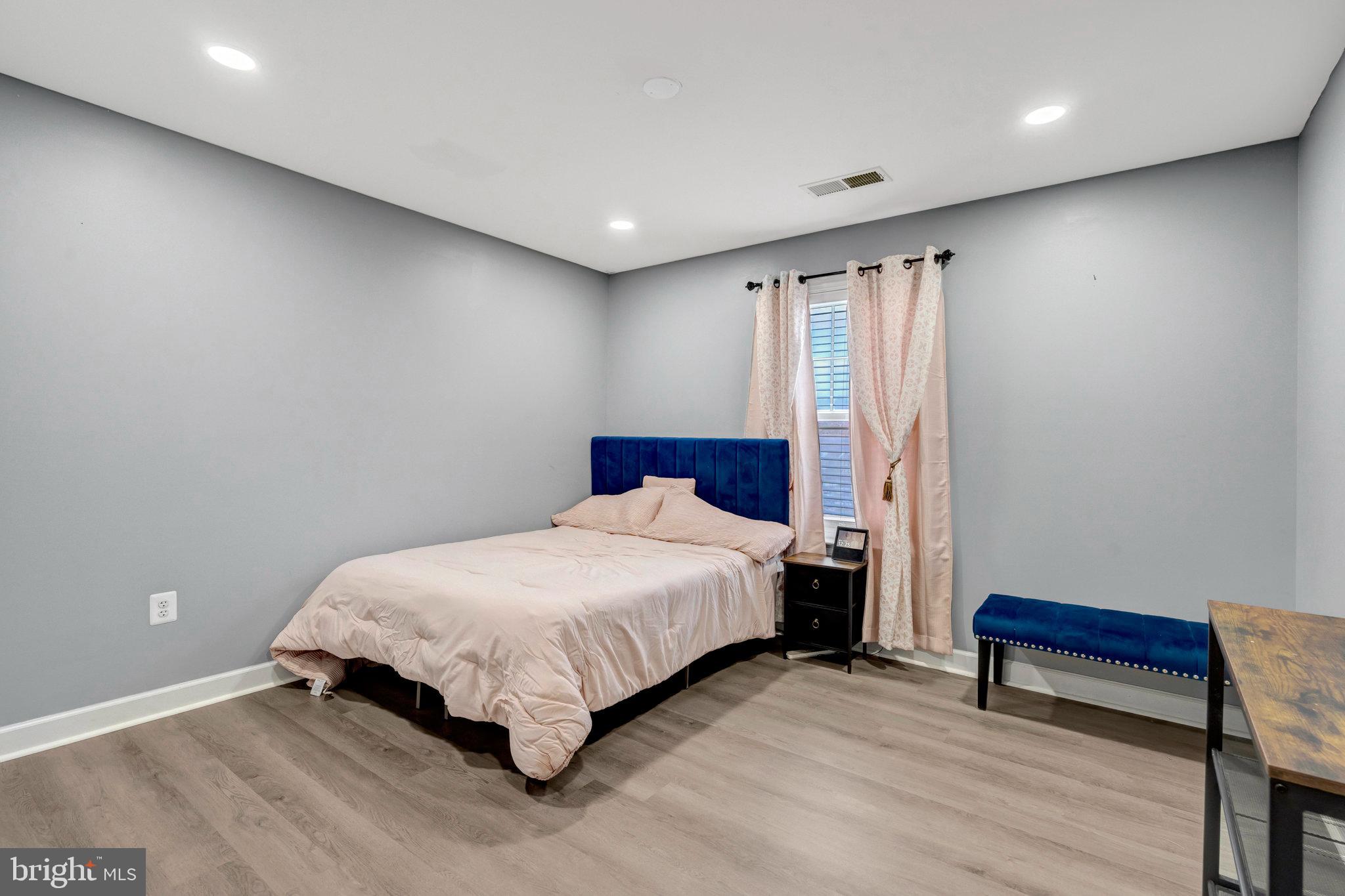 4169 Agency Loop Triangle, VA 22172 - Photo 29 of 56 Serene bedroom with modern touches.