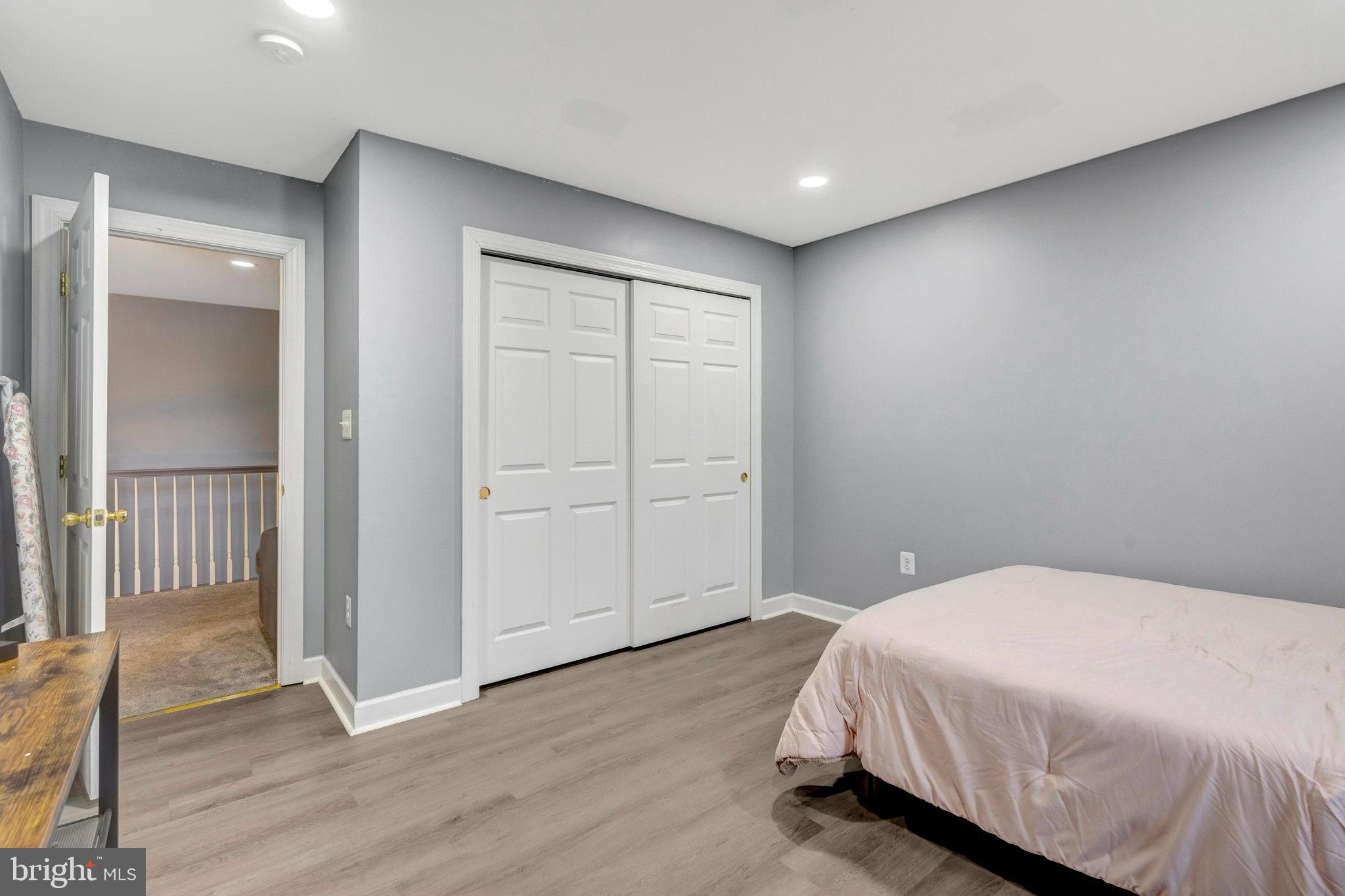 4169 Agency Loop Triangle, VA 22172 - Photo 30 of 56 Modern bedroom with sleek design elements.