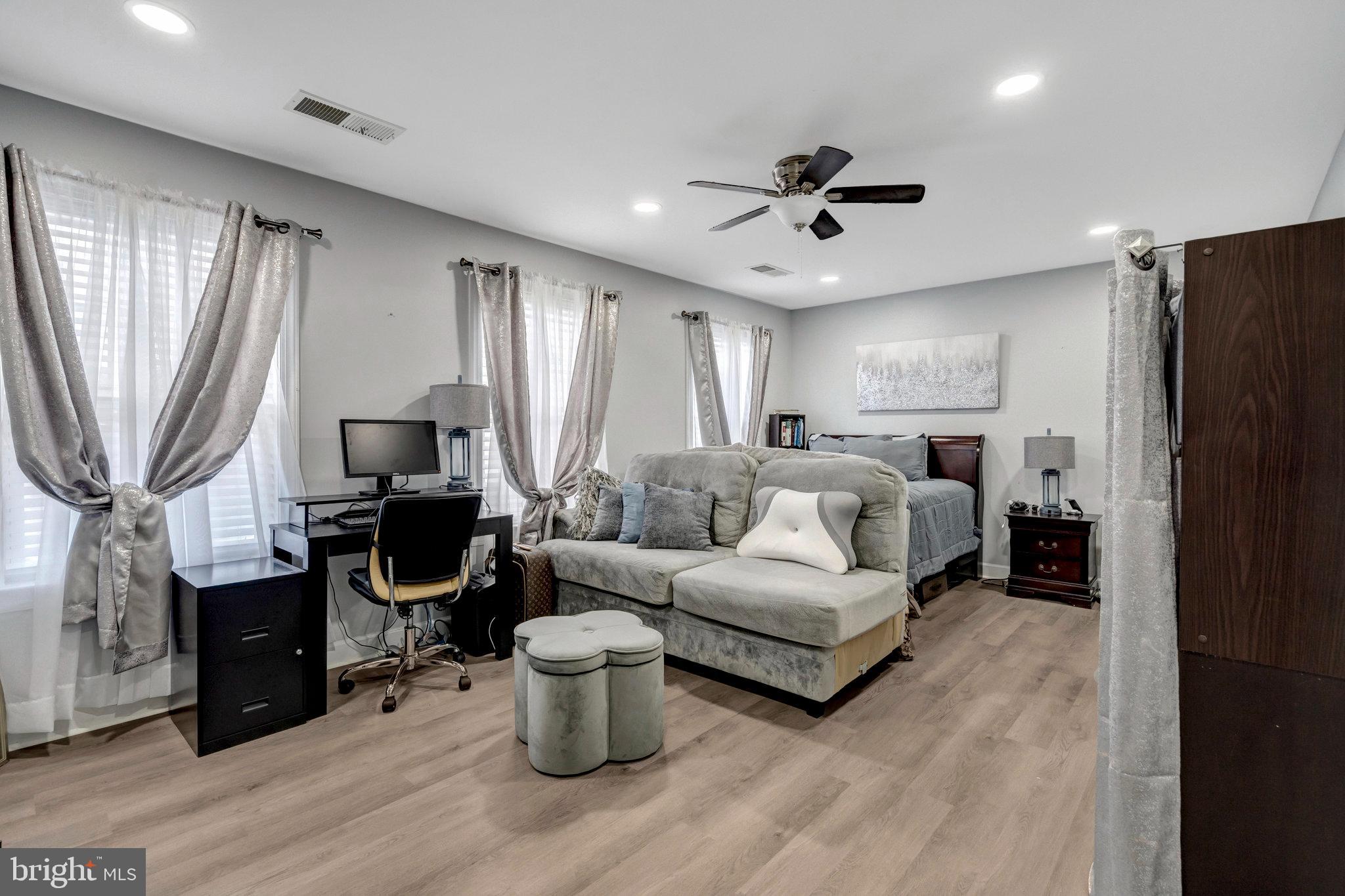 4169 Agency Loop Triangle, VA 22172 - Photo 31 of 56 a living room with furniture a fireplace and a window