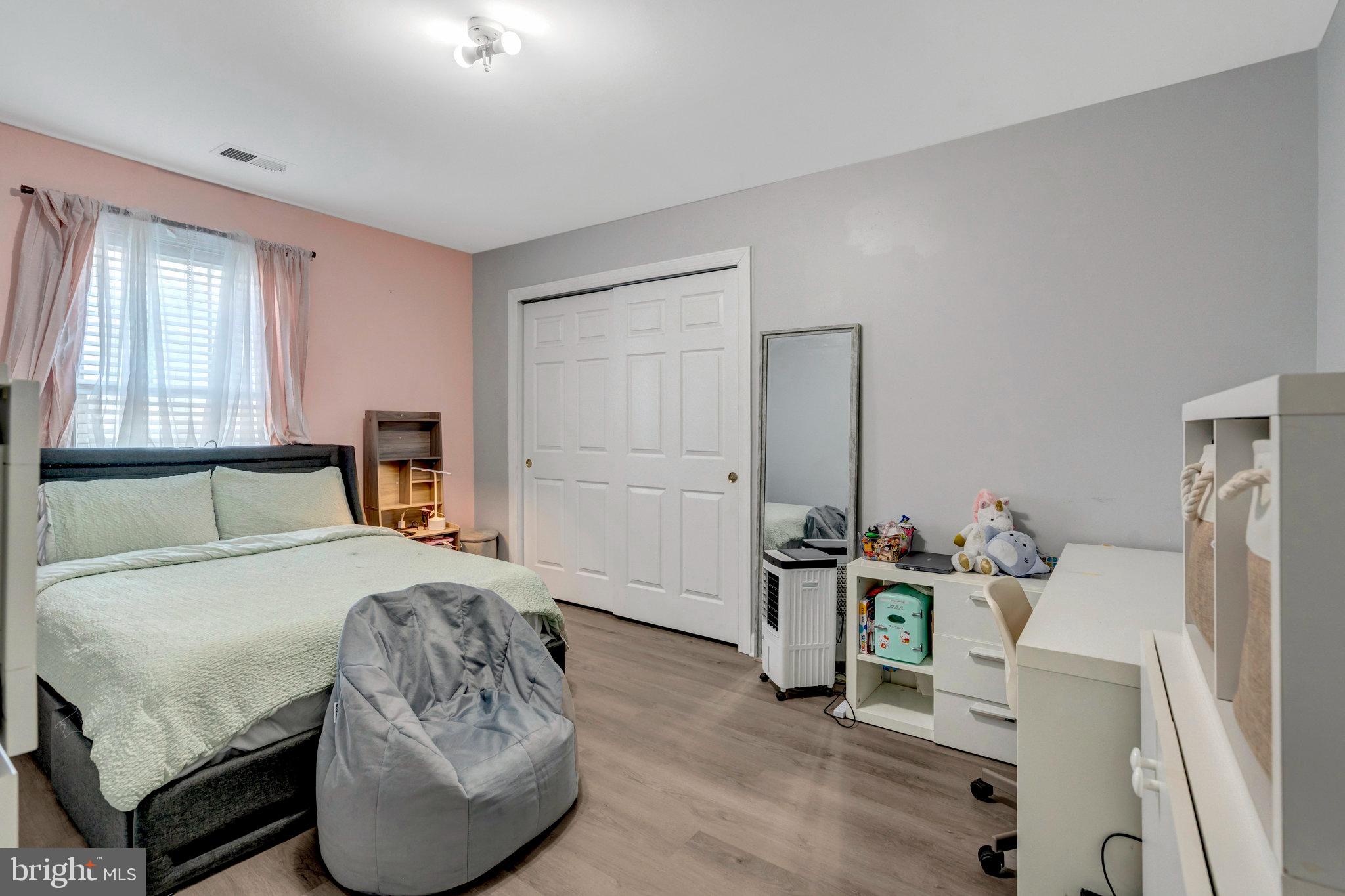 4169 Agency Loop Triangle, VA 22172 - Photo 32 of 56 Cozy bedroom with soft pastel accents.