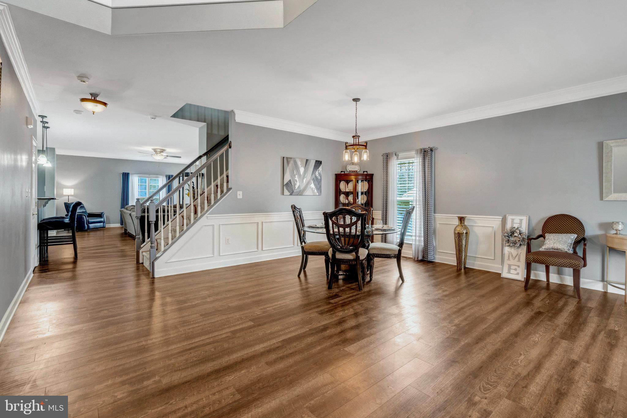 4169 Agency Loop Triangle, VA 22172 - Photo 5 of 56 a dining room with furniture entryway and wooden floor