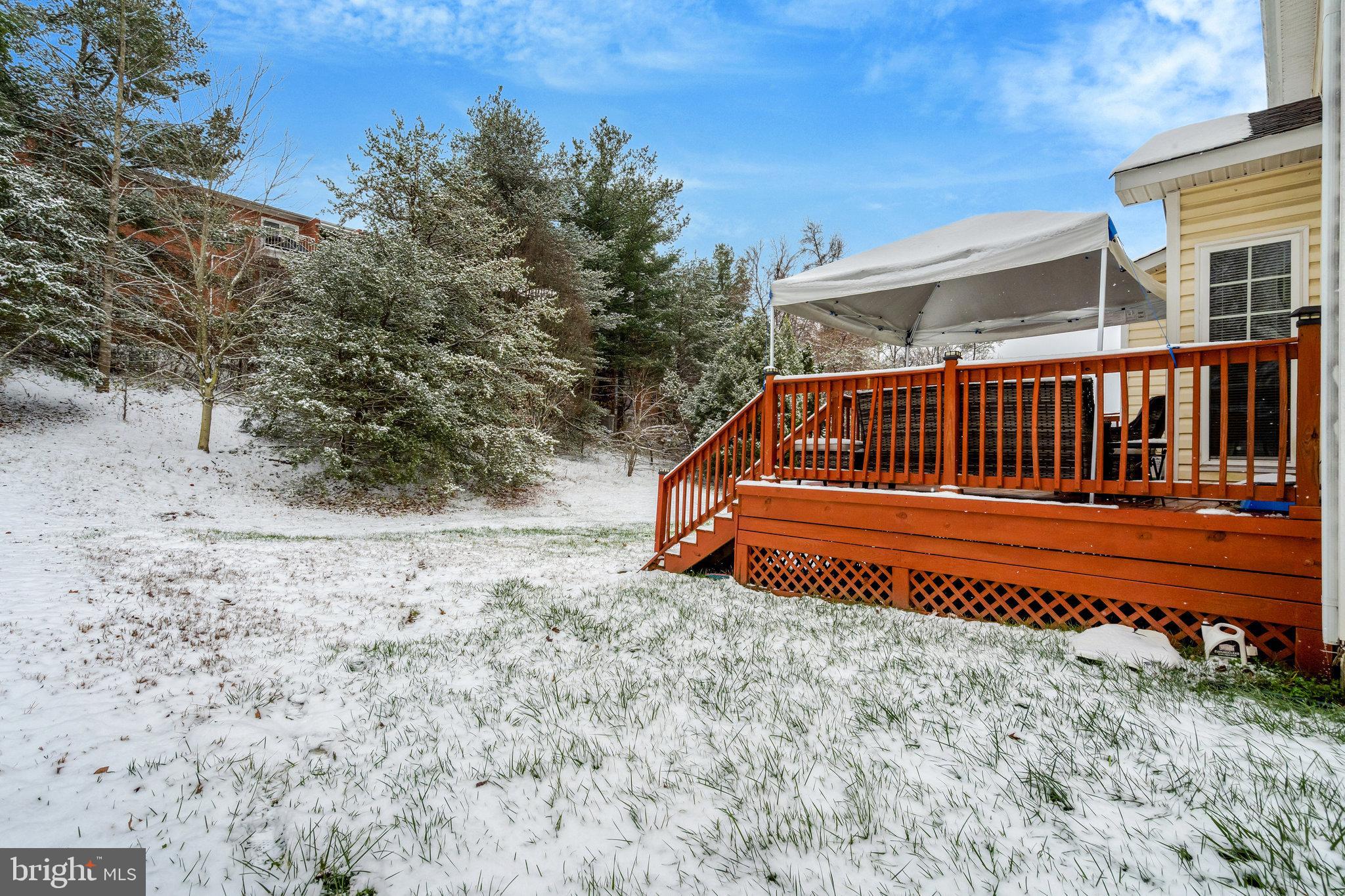 4169 Agency Loop Triangle, VA 22172 - Photo 51 of 56 Snowy backyard retreat with a cozy deck.
