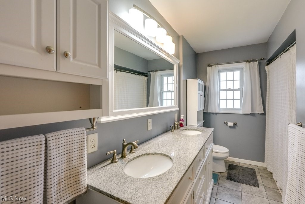 3204 Old Forge Road Kent, OH 44240 - Photo 27 of 42 Bathroom with tile patterned flooring, vanity, and toilet