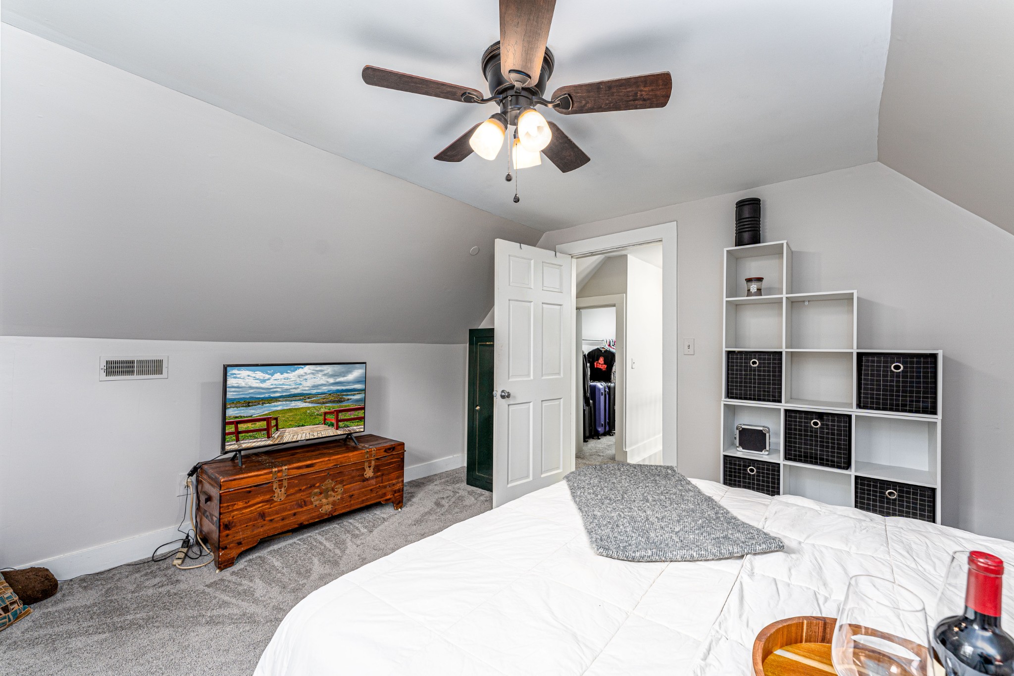 1156 Pierce Road Madison, TN 37115 - Photo 20 of 30 a bedroom with a bed and a chandelier