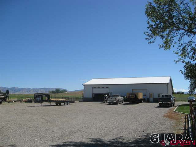 1452 16 Road Loma, CO 81524 - Photo 12 of 13 a view of a car parked in front of a building