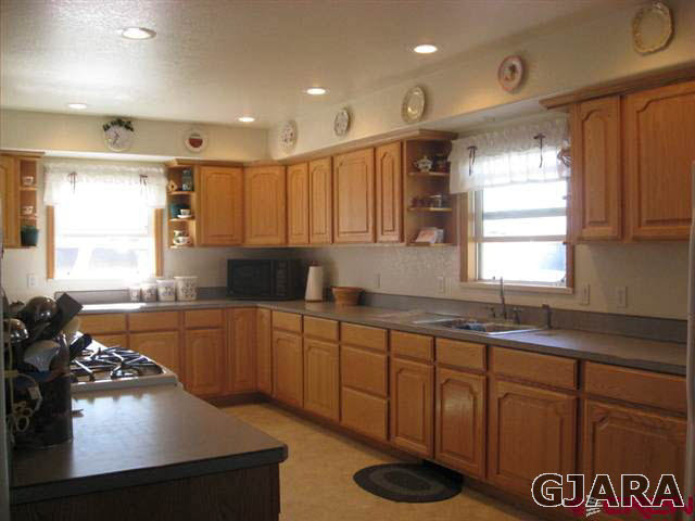 1452 16 Road Loma, CO 81524 - Photo 7 of 13 a kitchen with sink a stove and cabinets