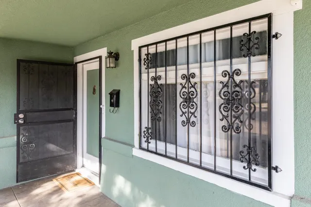 a view of a porch with a floor to ceiling window