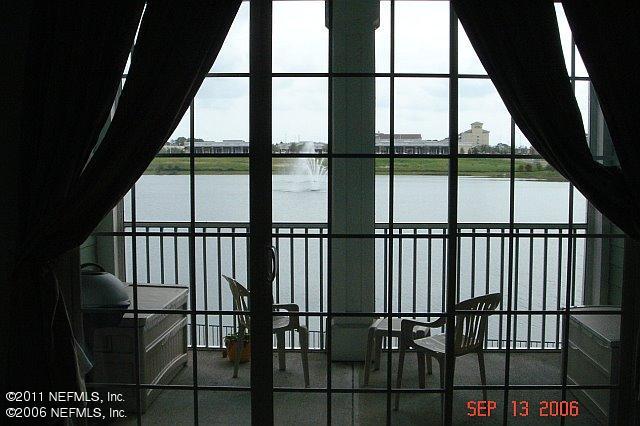 8550 Touchton Road, Unit 1424 Jacksonville, FL 32216 - Photo 1 of 5 a view of staircase with railing and large window