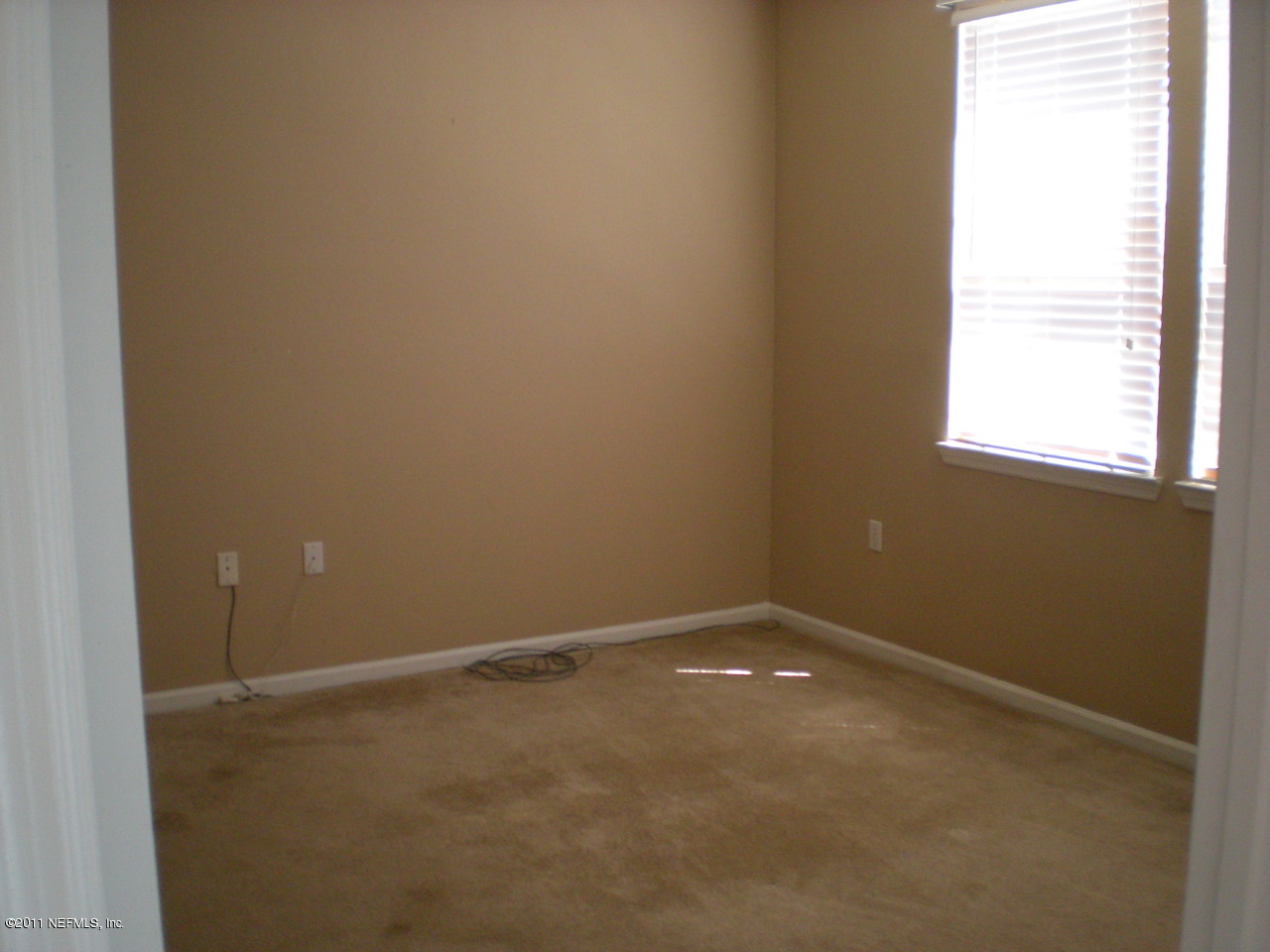 8550 Touchton Road, Unit 1424 Jacksonville, FL 32216 - Photo 4 of 5 an empty room with a window