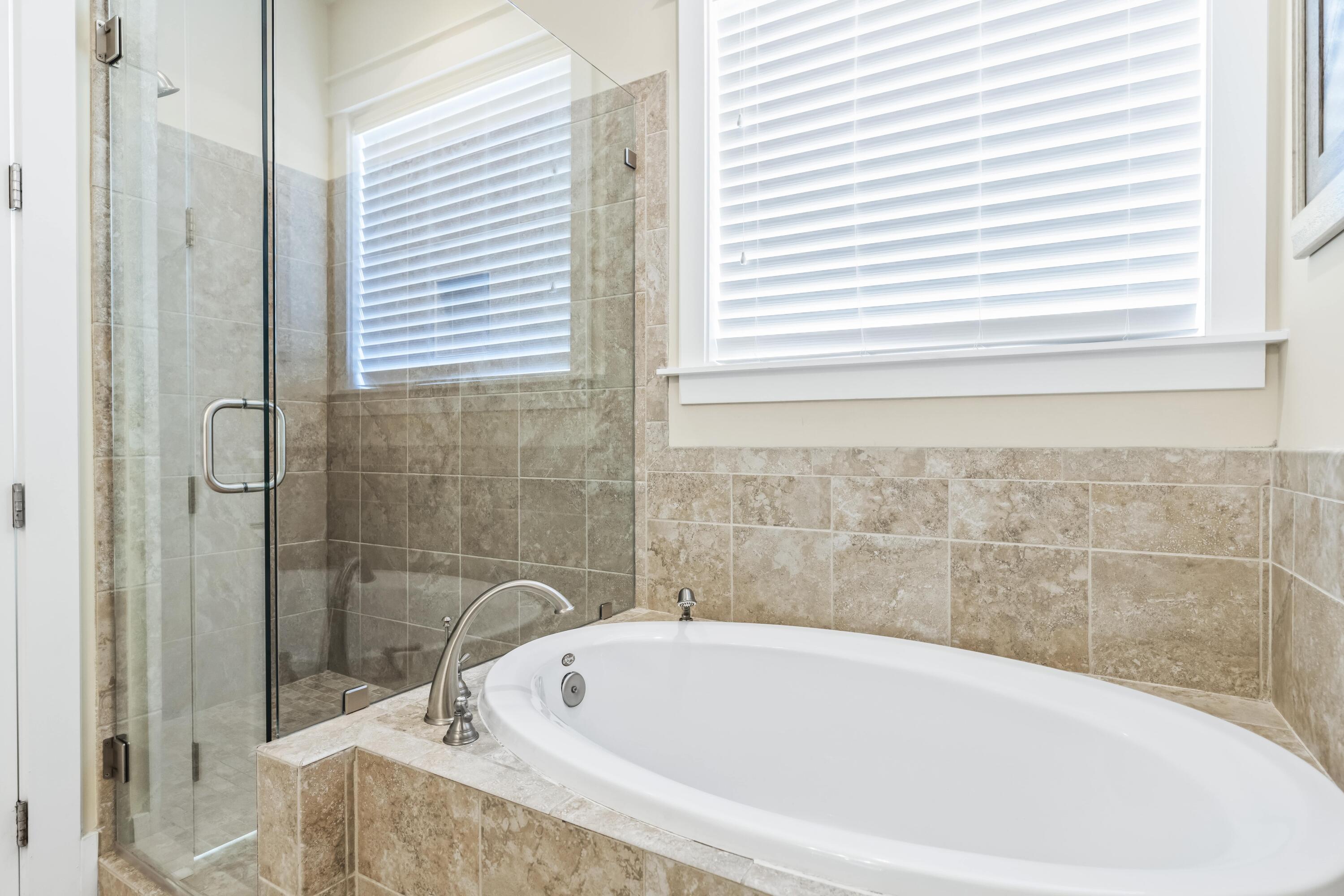 636 Flatwoods Forest Loop Santa Rosa Beach, FL 32459 - Photo 12 of 36 a bathroom with a bathtub and a shower
