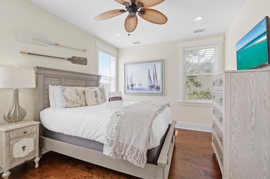 636 Flatwoods Forest Loop Santa Rosa Beach, FL 32459 - Photo 15 of 36 a bedroom with a bed and a chandelier