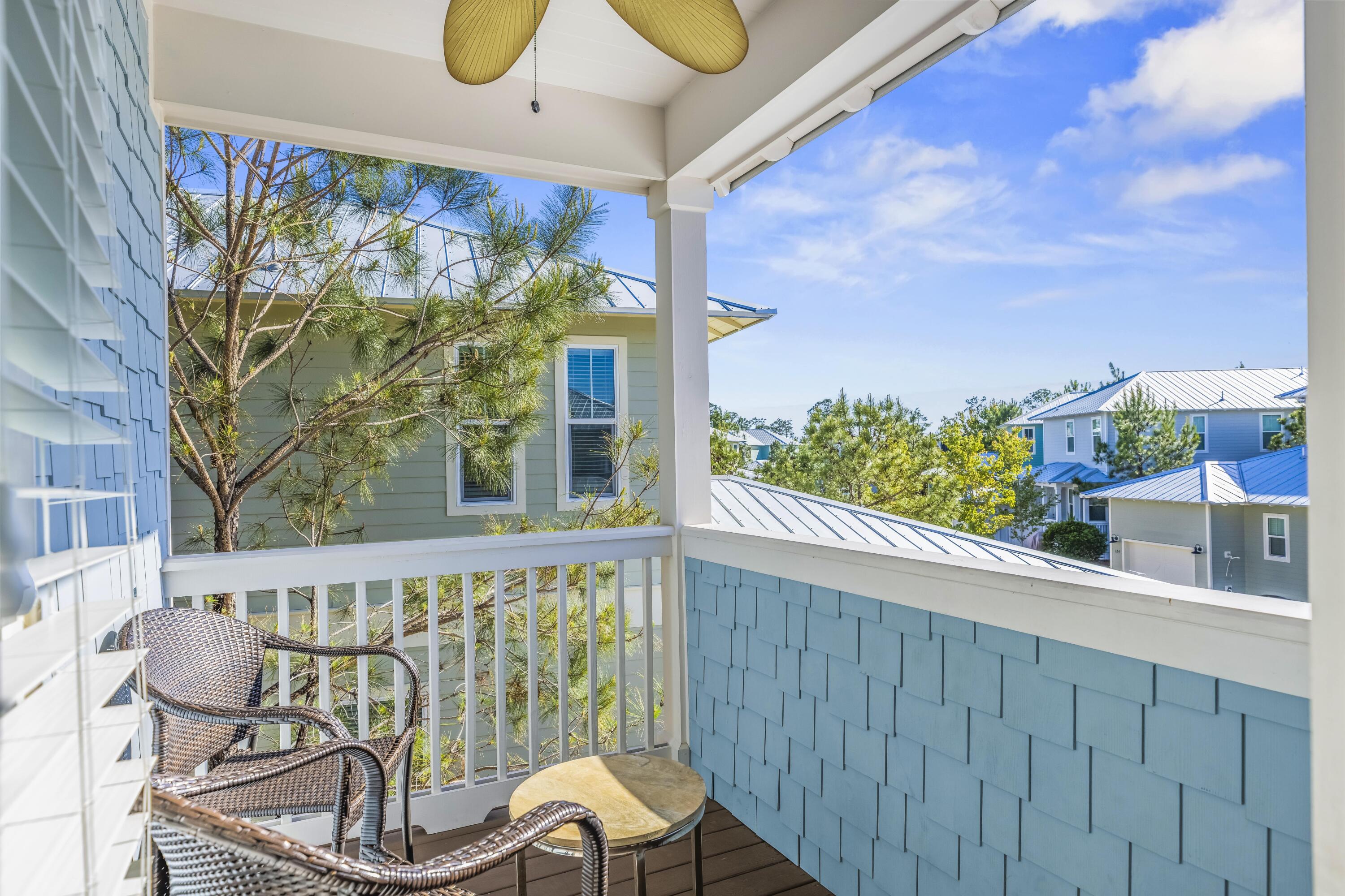 636 Flatwoods Forest Loop Santa Rosa Beach, FL 32459 - Photo 16 of 36 a view of a chairs and table in patio