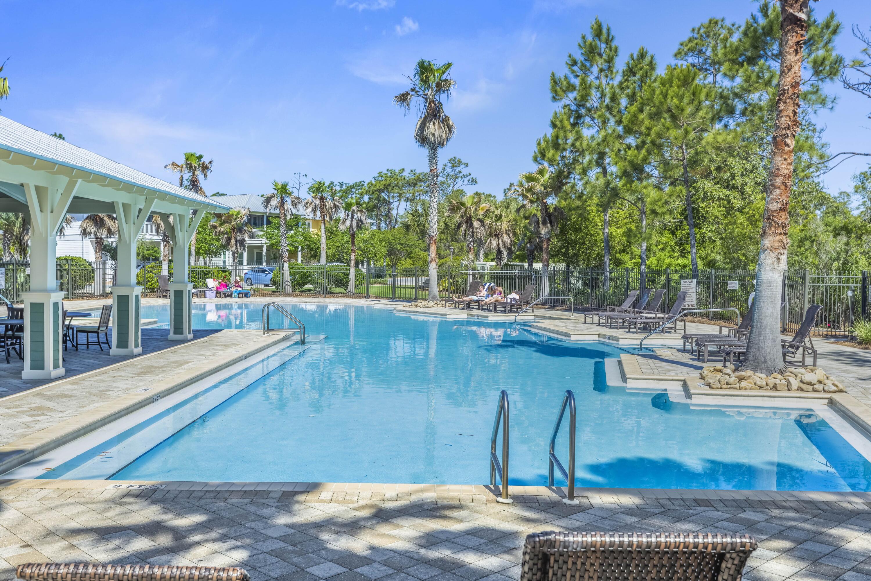 636 Flatwoods Forest Loop Santa Rosa Beach, FL 32459 - Photo 29 of 36 a view of a swimming pool with a patio