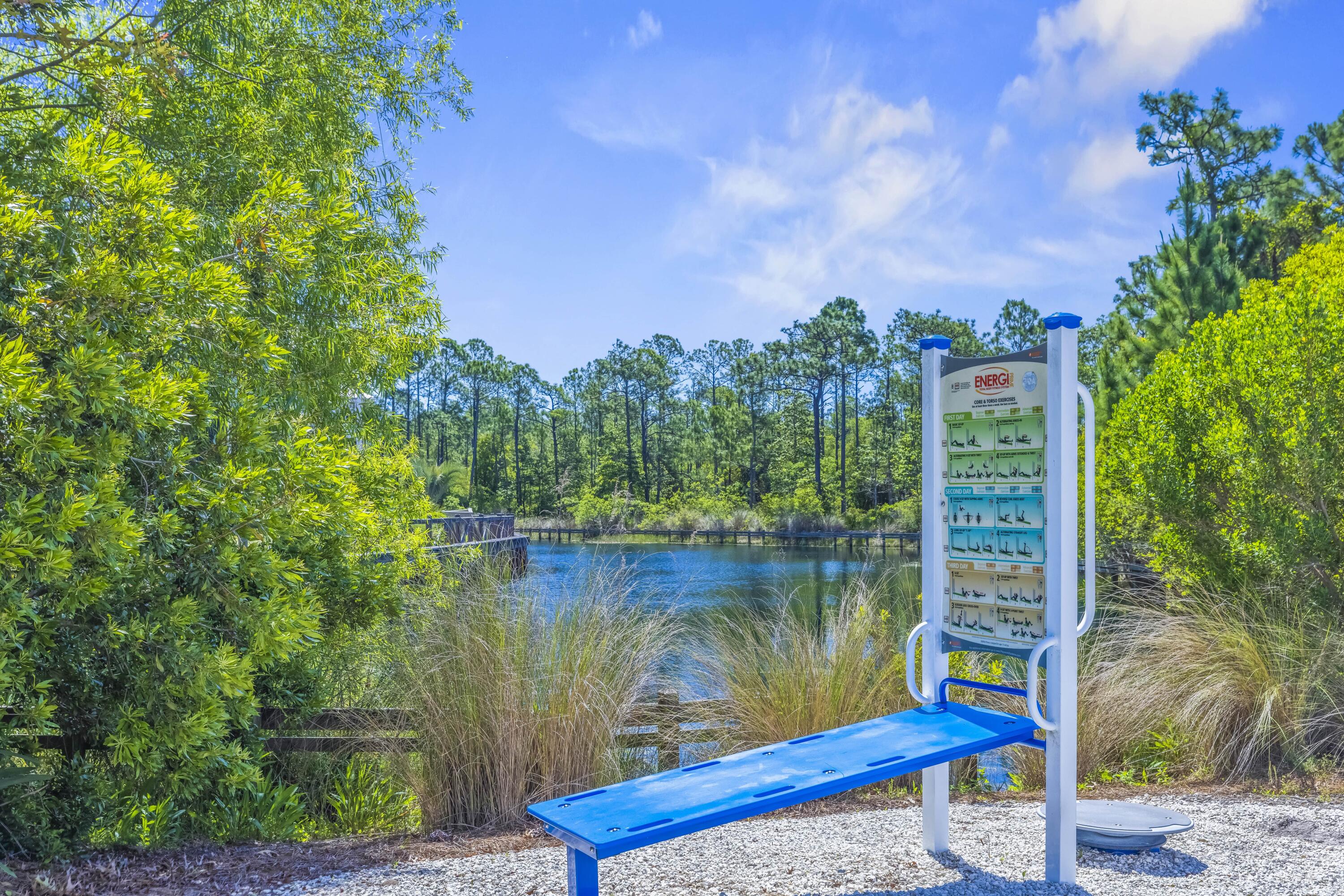 636 Flatwoods Forest Loop Santa Rosa Beach, FL 32459 - Photo 32 of 36 a view of a lake from a balcony with outdoor seating