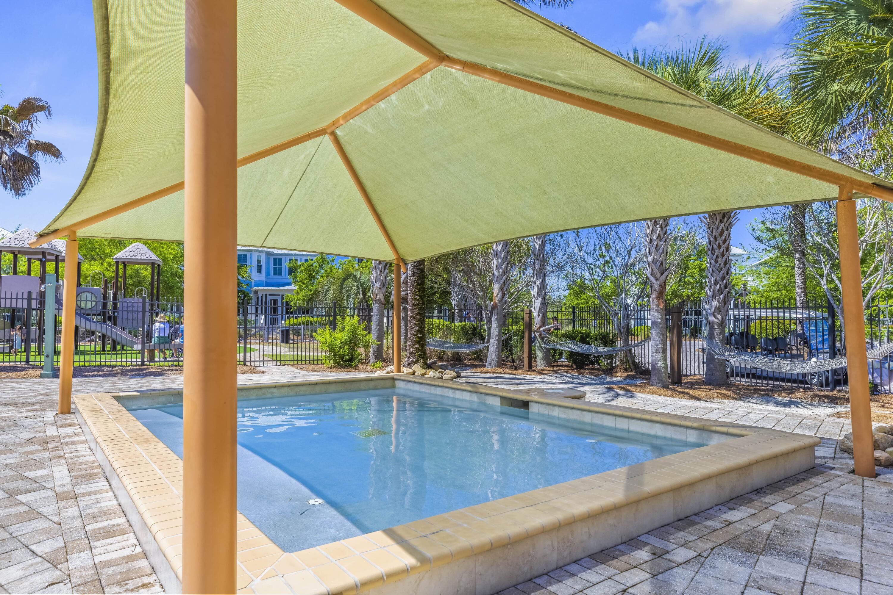 636 Flatwoods Forest Loop Santa Rosa Beach, FL 32459 - Photo 36 of 36 a view of a swimming pool with a patio