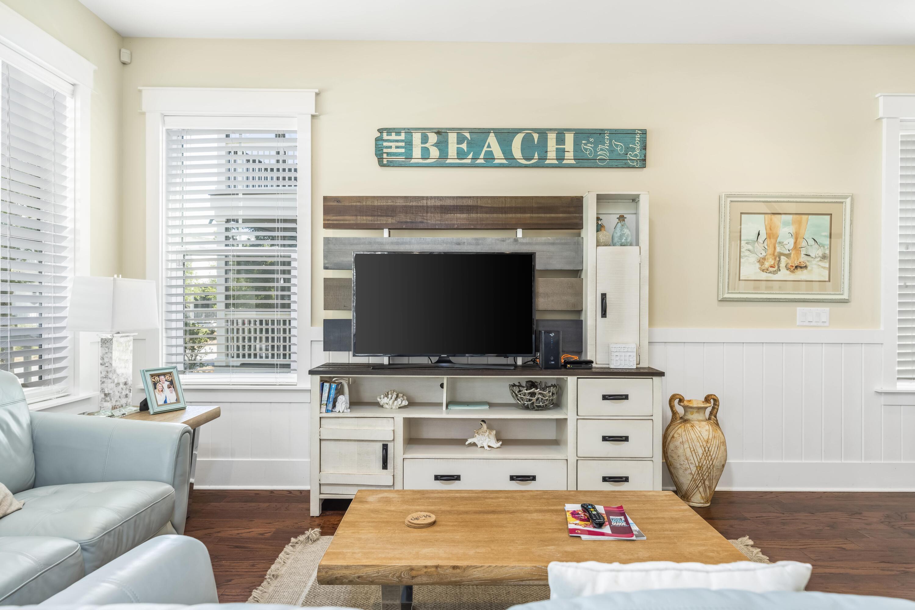 636 Flatwoods Forest Loop Santa Rosa Beach, FL 32459 - Photo 5 of 36 a living room with furniture and a flat screen tv