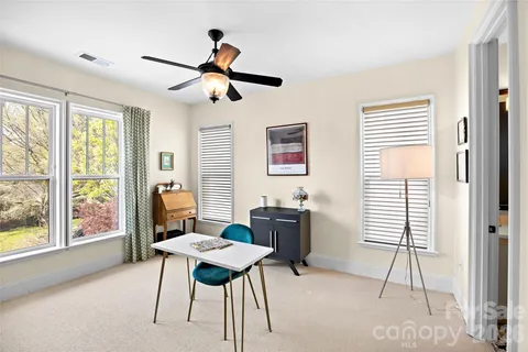 a workspace with furniture and a window