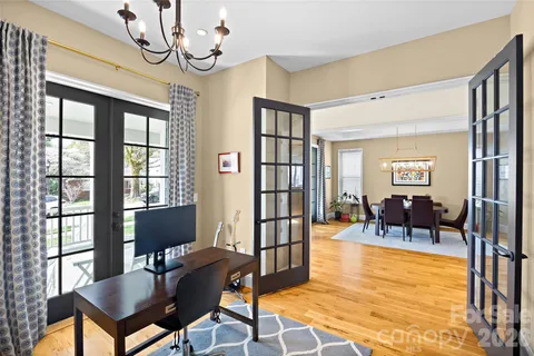 a view of a livingroom with furniture window and wooden floor