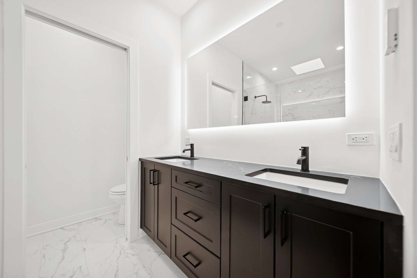 1333 East Madison Park Chicago, IL 60615 - Photo 12 of 32 a bathroom with a sink and a mirror