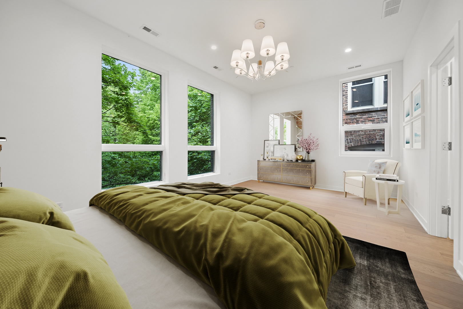 1333 East Madison Park Chicago, IL 60615 - Photo 14 of 32 a bedroom with a large bed and a chandelier