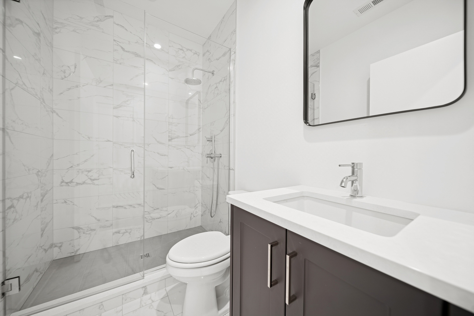1333 East Madison Park Chicago, IL 60615 - Photo 20 of 32 a bathroom with a sink a toilet and shower