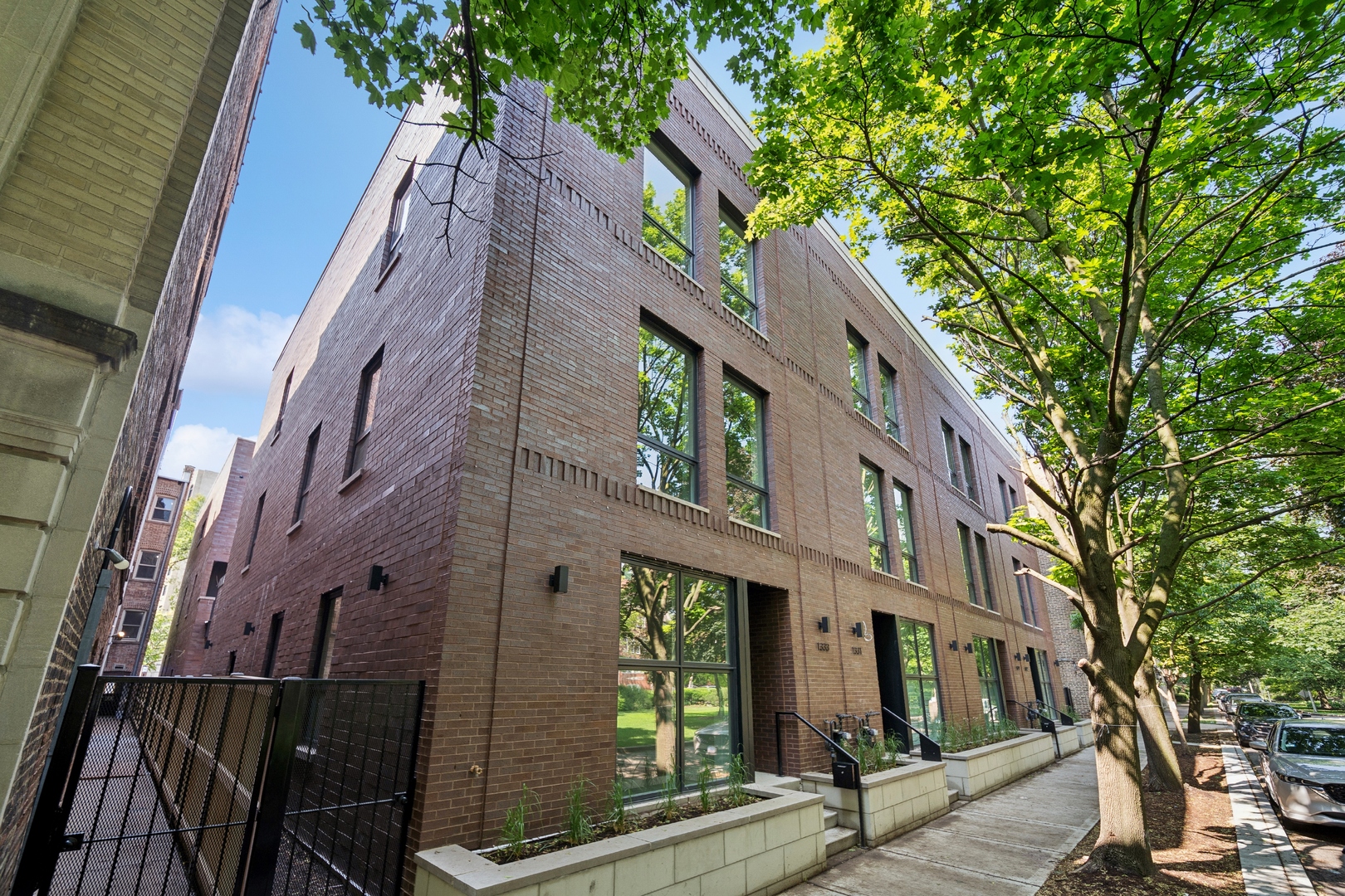 1333 East Madison Park Chicago, IL 60615 - Photo 2 of 32 a view of a large building with a tree