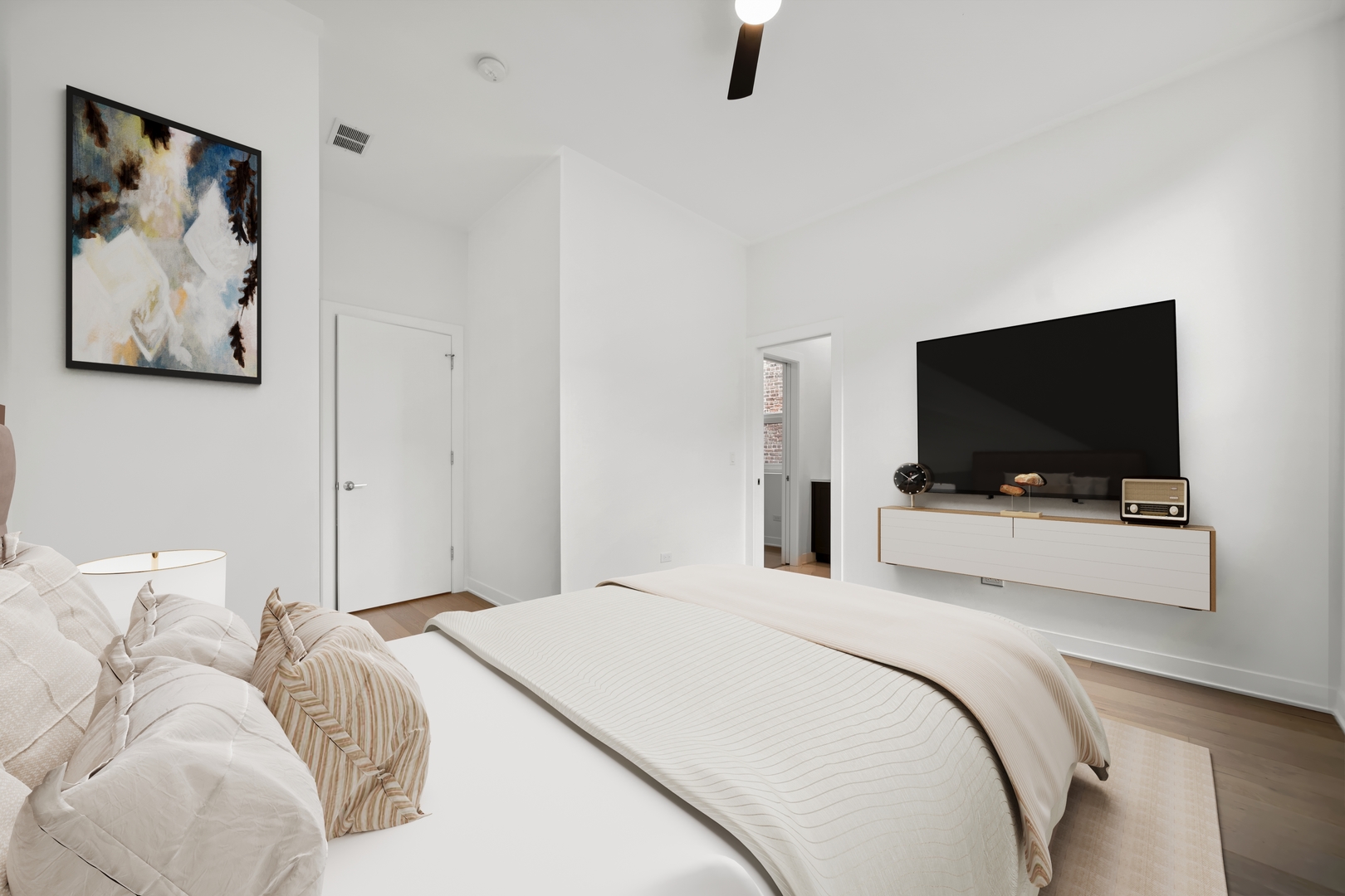 1333 East Madison Park Chicago, IL 60615 - Photo 22 of 32 a bedroom with a flat screen tv and a bed