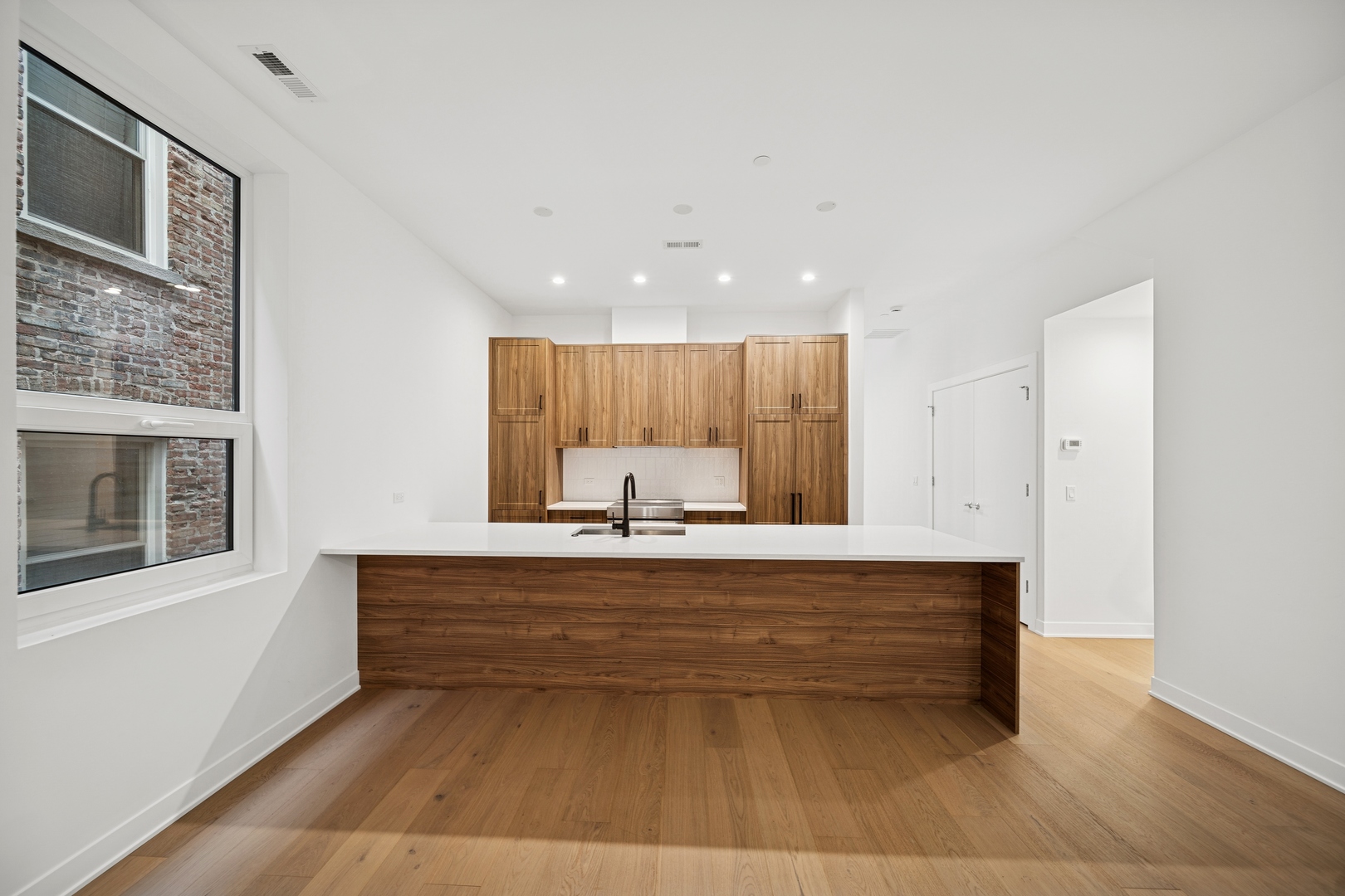 1333 East Madison Park Chicago, IL 60615 - Photo 5 of 32 a view of kitchen with stainless steel appliances wooden floor and large window