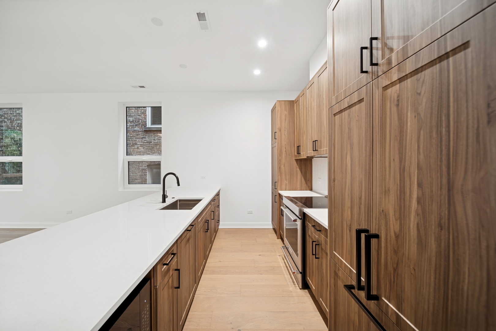 1333 East Madison Park Chicago, IL 60615 - Photo 7 of 32 a kitchen with a sink and refrigerator