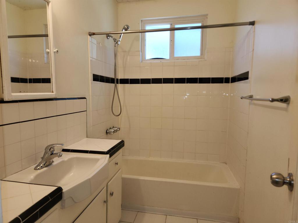 3525 Calavo Drive Spring Valley, CA 91978 - Photo 14 of 21 a bathroom with a shower and a bath tub