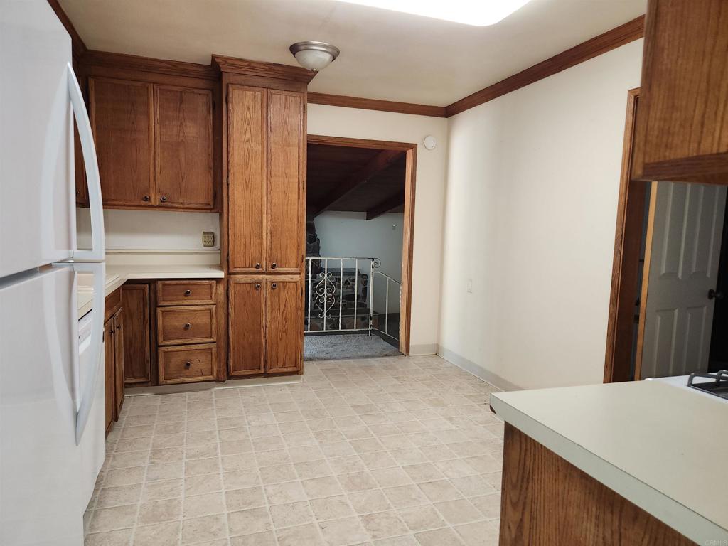 3525 Calavo Drive Spring Valley, CA 91978 - Photo 8 of 21 a view of a kitchen from the hallway