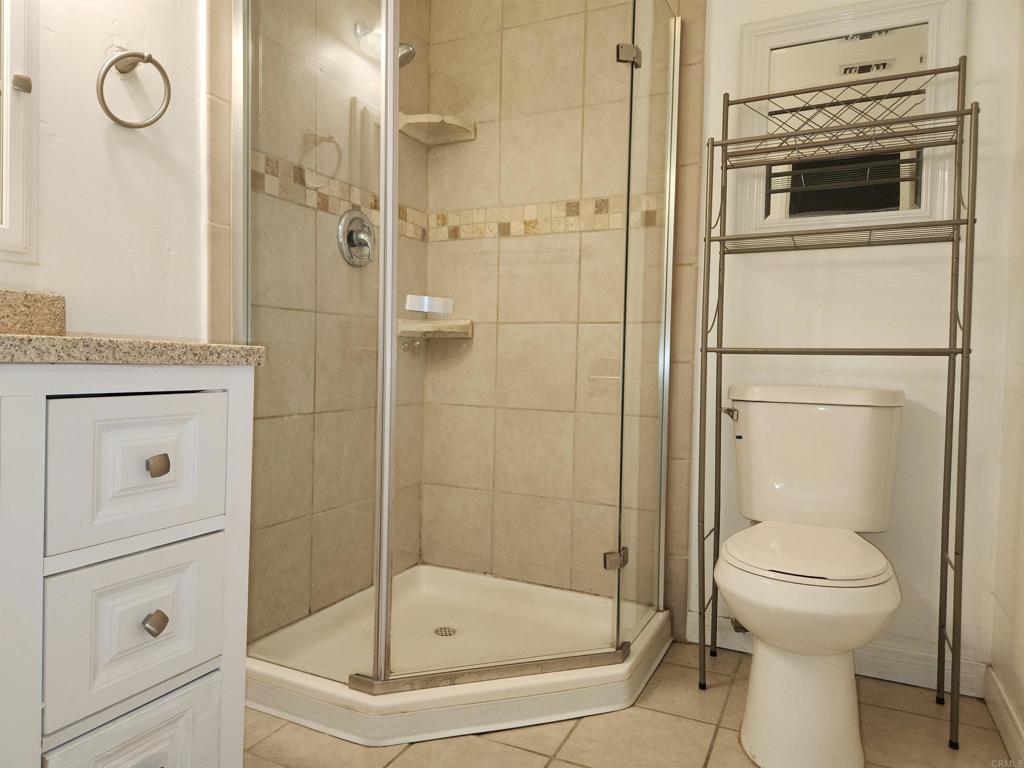 3525 Calavo Drive Spring Valley, CA 91978 - Photo 10 of 21 a bathroom with a shower a toilet and a sink