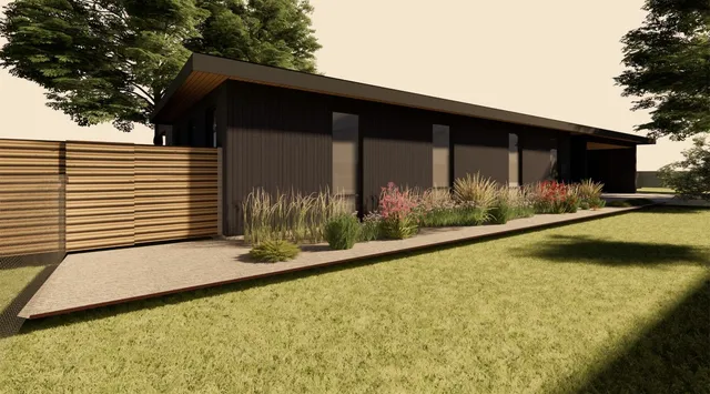 a view of house with backyard and sitting area