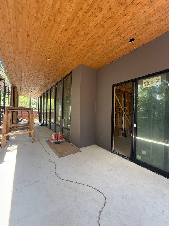 3007 Perry Lane Austin, TX 78731 - Photo 20 of 24 a bedroom with furniture and large windows