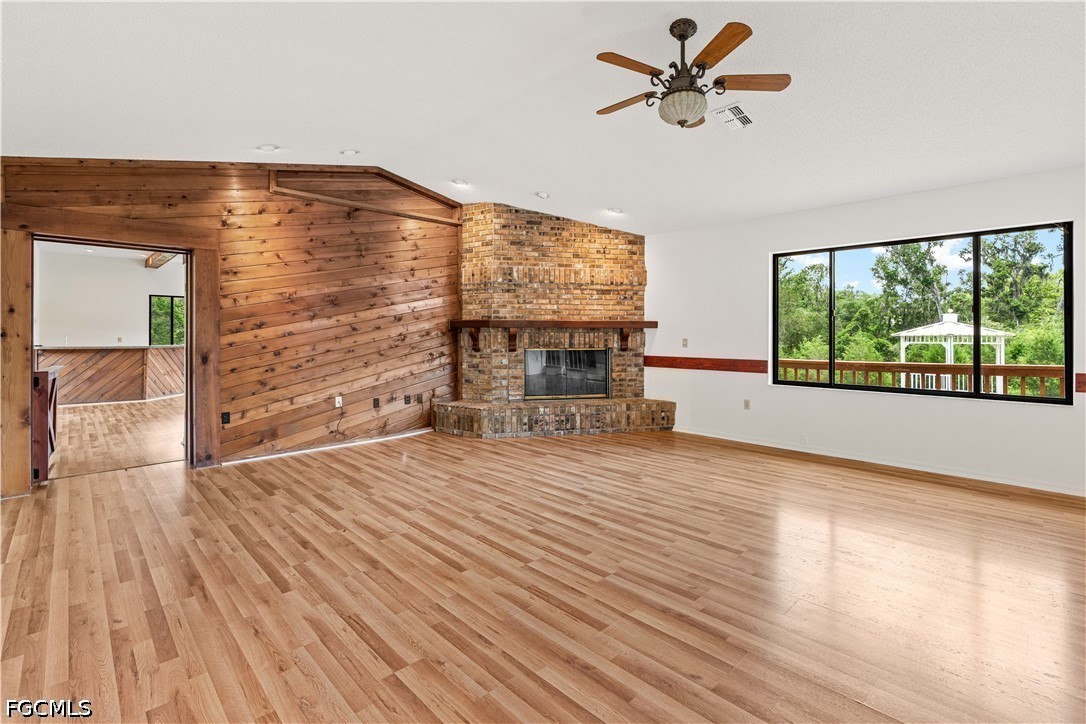 27255 Hickory Hill Road Brooksville, FL 34602 - Photo 28 of 50 wooden floor in an empty room with a window