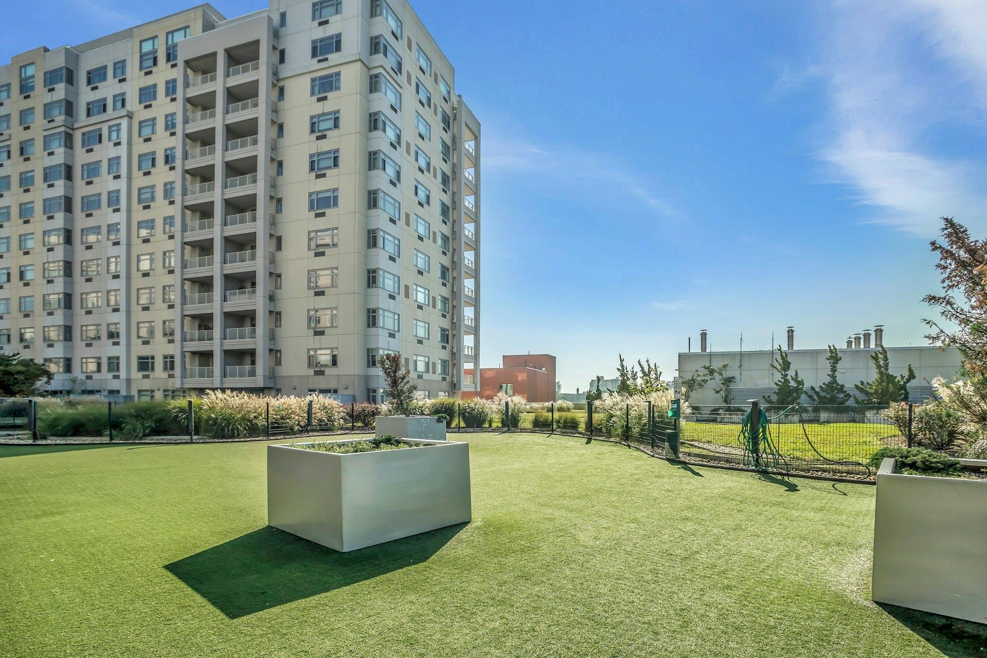 131-03 40 Road, Unit 10E Queens, NY 11354 - Photo 14 of 15 a view of a city with tall buildings