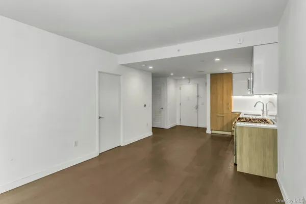 a view of a storage and utility room with washer and dryer