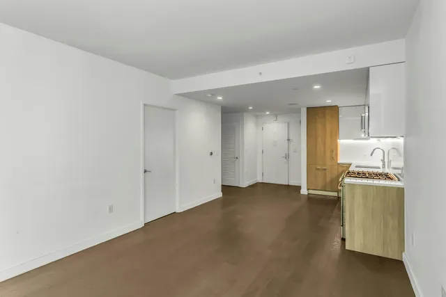 a view of a storage and utility room with washer and dryer