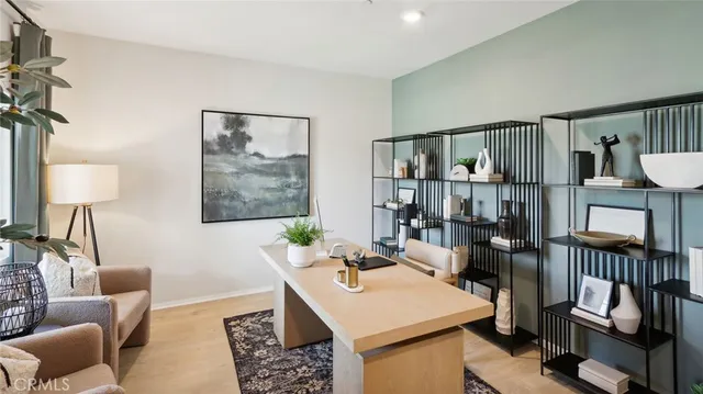 a living room with furniture a rug and a window